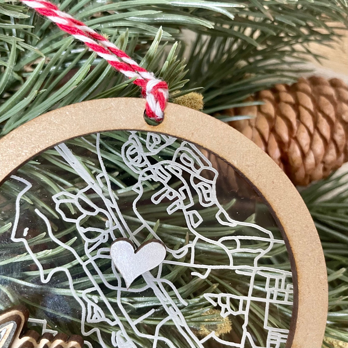 close up of wood an acrylic map ornaments showing engraving