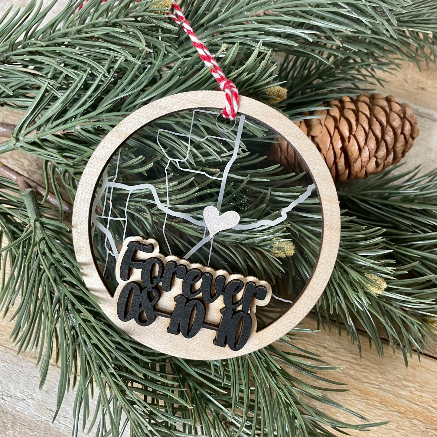 Map ornament with acrylic and wood, has wedding dates